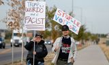 Demonstranten bij een verkiezingsbijeenkomst van Trump in Aurora, Colorado, 11 oktober.